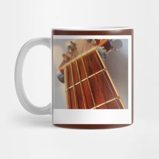 photo of the neck of an acoustic guitar Mug